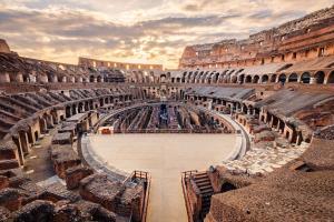 Scenic view of Roman Colosseum interior at sunset, Rome, Italy