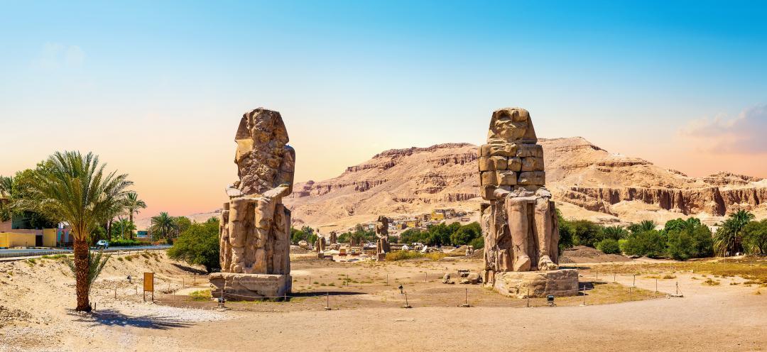 Egypt. Luxor. The Colossi of Memnon - two massive stone statues of Pharaoh Amenhotep